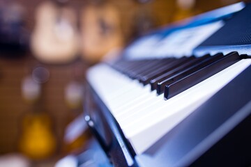 synthesizer close up in music store black and white key