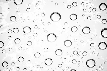 white isolated background water drops on the glass / wet window glass with splashes and drops of water and lime, texture autumn background