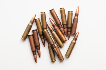 A group of bullet ammunition shells on a white background