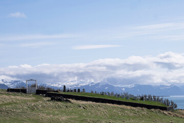 Fototapeta premium Typical rural cemetery in Iceland on a sunny day with blue sky and clouds