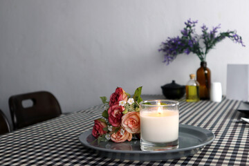 luxury aroma scented soy wax candle is displayed on the dinning table in the dinning room during the christmas new year celebration party
