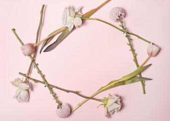 frame of flowers tulips carnations and roses on a pink background