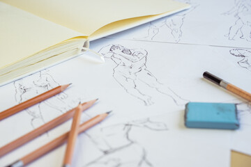 Fototapeta na wymiar Artist drawing figure pencil sketches. Artwork background