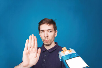 Man refusing a cigarettes. Face emotion while propose smoke cigarettes. Concept Quitting smoking, World No Tobacco Day.