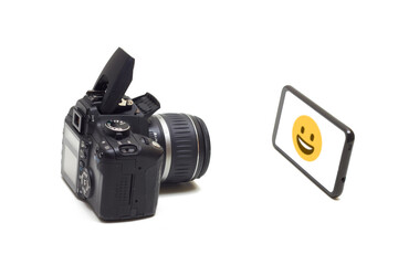 old film camera and smartphone