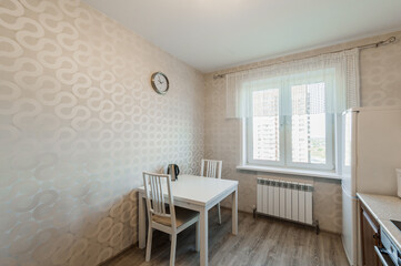 Russia, Moscow- April 25, 2020: interior room cozy. general cleaning, home decoration, preparation house for sale. kitchen and dining room, refectory area, cooking appliances, table furniture stove