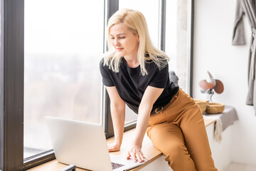 Hipster woman use Laptop huge Loft Studio. Student Researching Process Work. Young Business Woman Working Creative Startup modern Office. Analyze market stock, new strategy