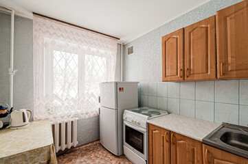 Russia, Moscow- April 25, 2020: interior room cozy. general cleaning, home decoration, preparation house for sale. kitchen and dining room, refectory area, cooking appliances, table furniture stove