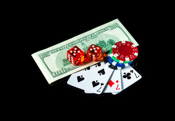 Three of a kind or set cards combination and dollars with chips. Winning combination at a poker...