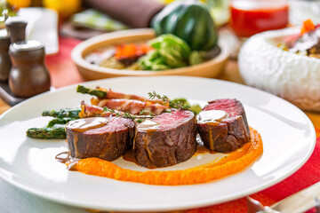 Served table in a restaurant with meat dishes