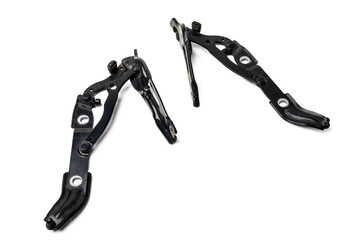 Pair of hinges for attaching the hood or trunk of the car on a white isolated background. Auto parts for catalog and repair of vehicles.