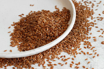 Raw Flax seeds in a ceramic plate