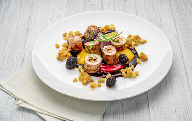 Roll stuffed with mushrooms and vegetables with berry sauce