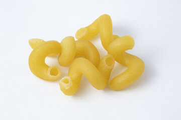 Group of cavatappi or cellentani pasta uncooked. Mac and cheese noodles.