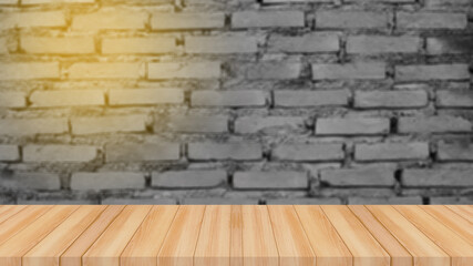 Old wood table with abstract blurred brick wall background for product display