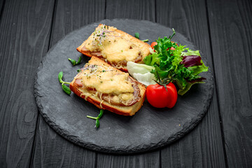 French toast ham cheese and salad on dish