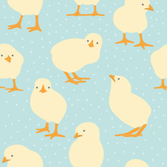 Seamless pattern with cute chicks on dotted blue background. Easter vector illustration.