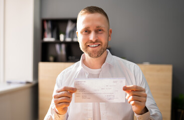 Holding Paycheck In Hand