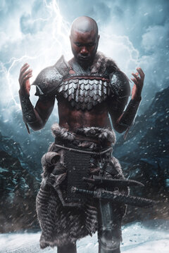 Religious african viking prays to thor in thunderstorm in mountains