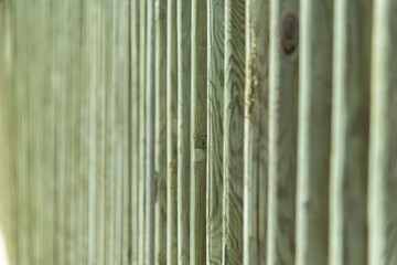 A green wooden fence