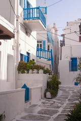 Empty cobbled streets, without people, whitewashed and white painted buildings in spring, in Mykonos town, Cyclades islands in the Aegean Sea. Charming place.