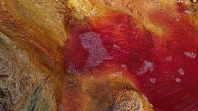 Reddish water at the source of the Rio Tinto in Huelva