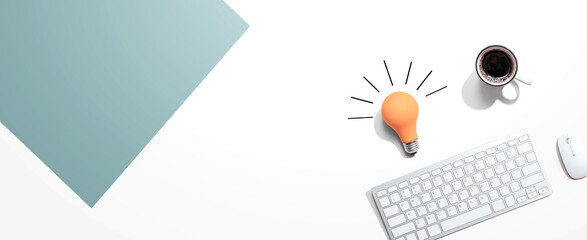 Computer keyboard with a yellow light bulb