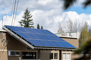 Fototapeta premium Solar Panels Installed on Entry Roof of a Local Business