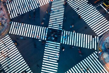 Traffic and people cross a busy intersection in Ginza