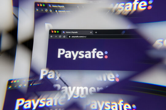 Milan, Italy - APRIL 10, 2021- Paysafe company logo  on laptop screen seen through an optical prism, creative interpretation. Dynamic and unique image from Paysafe website. Illustrative editorial.