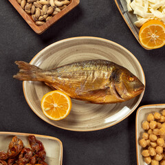 Roasted grilled fish with lemon from top view