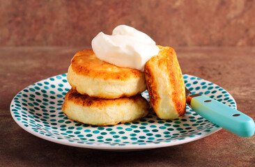 Soft cheese fritters on plate