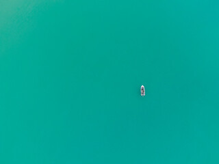 boat in the aqua sea cornwall england uk green aerial 