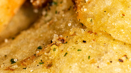 Natural fat potato chips with salt, black pepper, herbs and vegetable oil