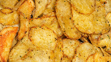 Natural fat potato chips with salt, black pepper, herbs and vegetable oil