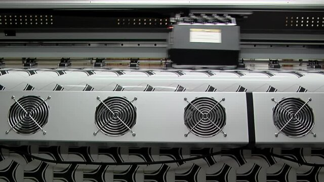 Football Printing Machine, Synthetic Leather Printer in the Production Line of a Soccer Ball Factory. Close Up.