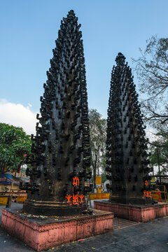 Ujjain, India - March 2021: Stone towers with oil lamps at the Harsiddhi Temple in Ujjain on March 23, 2021 in Madhya Pradesh, India.