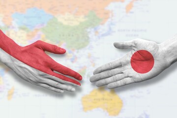 Indonesia and Japan - Flag handshake symbolizing partnership and cooperation