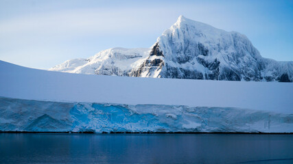 Snow covered Mountains and Icebergs in the Antarctic Peninsula on Antarctica.