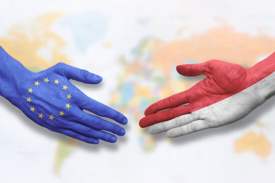Indonesia and European Union - Flag handshake symbolizing partnership and cooperation