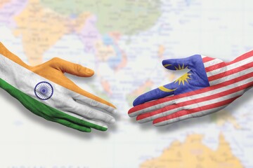 Malaysia and India - Flag handshake symbolizing partnership and cooperation