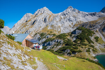 Fototapeta na wymiar mountain lodge Coburger Huette, above lake Drachensee, hiking area Ehrwald austria