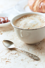 Coffee with milk on bright stone background. Close up.	