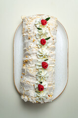 chocolate biscuit cake with nuts. with condensed milk on a white platter High quality photo