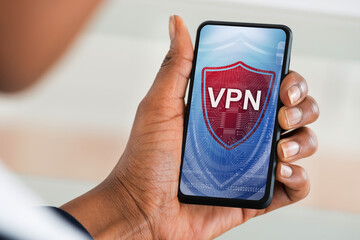 Woman Reading News On Mobile Phone