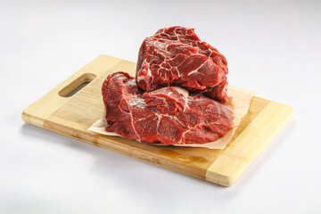 Raw beef neck over board