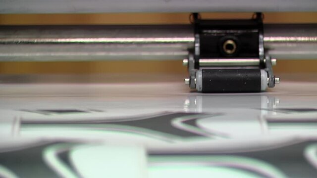 Football Printing Machine, Synthetic Leather Printer in the Production Line of a Soccer Ball Factory. Close Up.