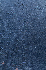 The rough surface. The black old paint is weathered and falls from the grunge metal background. Structural painted