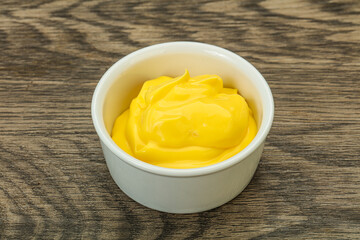 Natural cheese sauce in the bowl