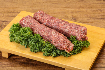 Raw minced beef kebab skewer